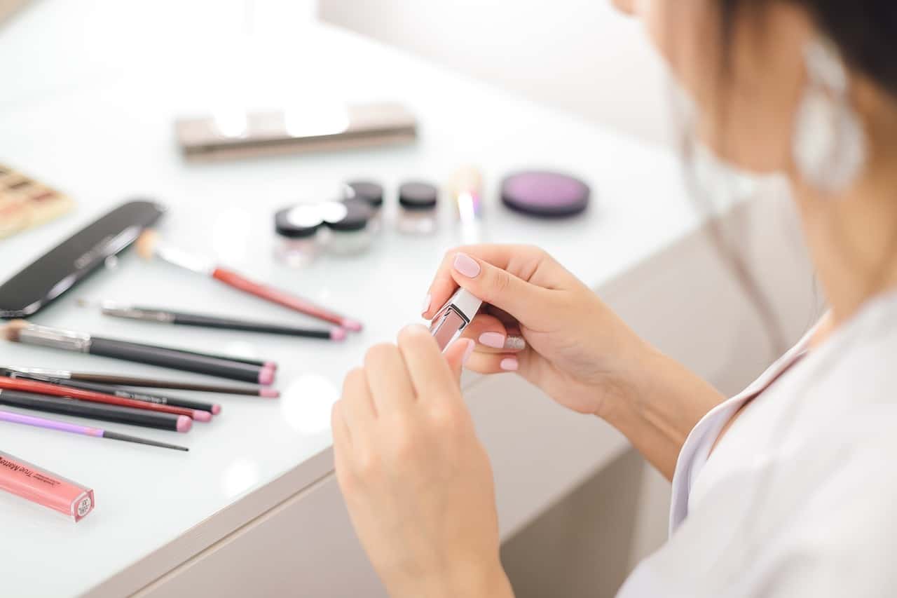 a woman doing makeup